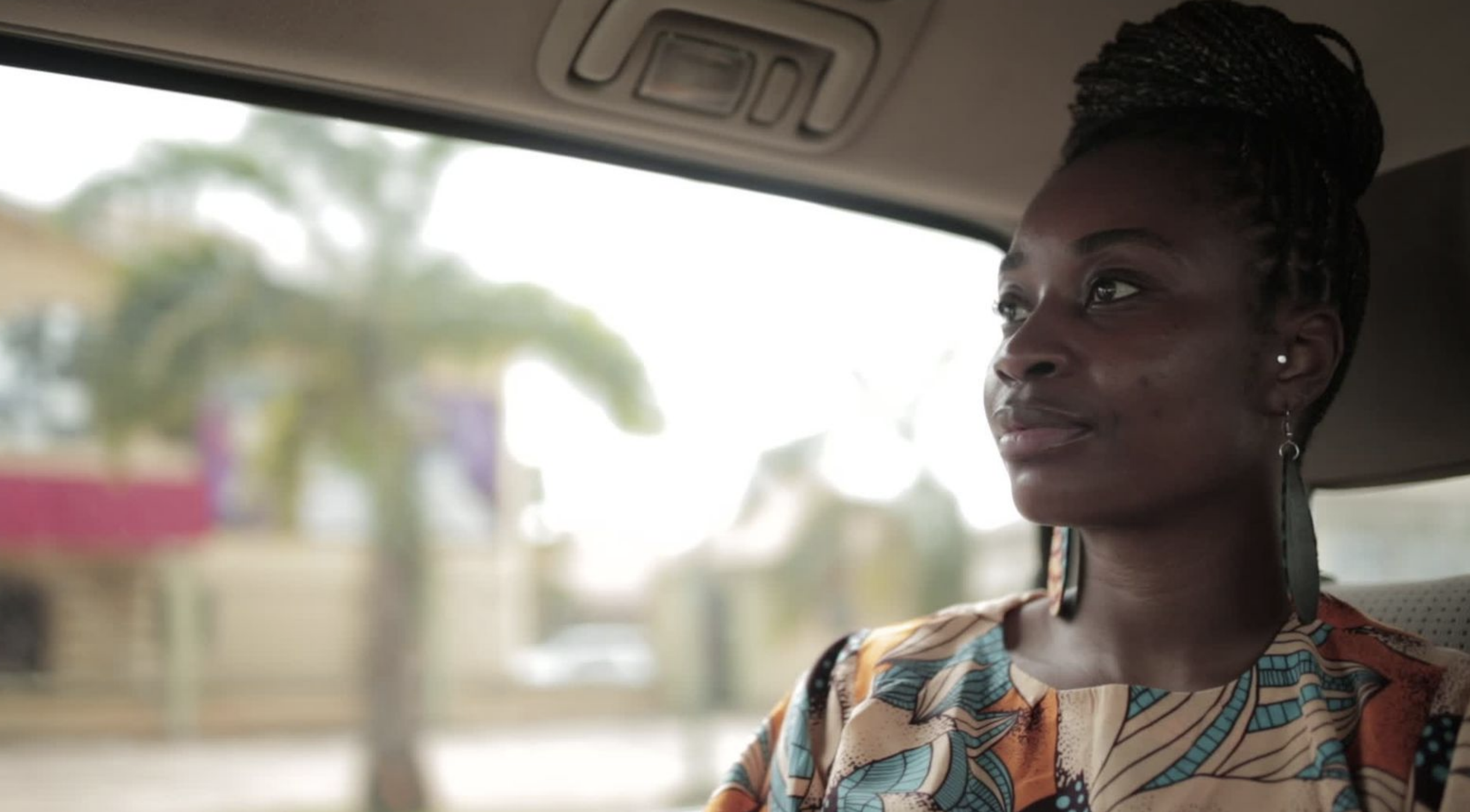 Uzoamaka in a car